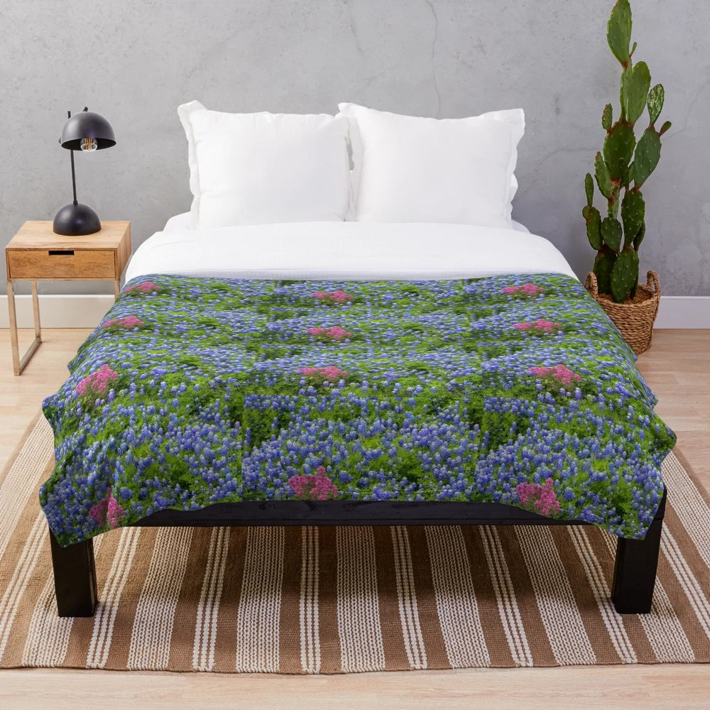 Plush blanket featuring vibrant springtime wildflowers like bluebonnets and prairie paintbrush