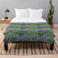 Plush blanket featuring vibrant springtime wildflowers like bluebonnets and prairie paintbrush