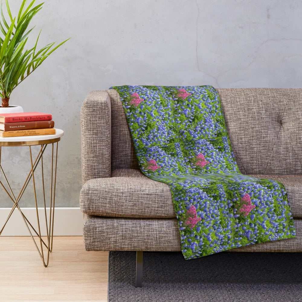 Plush blanket featuring vibrant springtime wildflowers like bluebonnets and prairie paintbrush