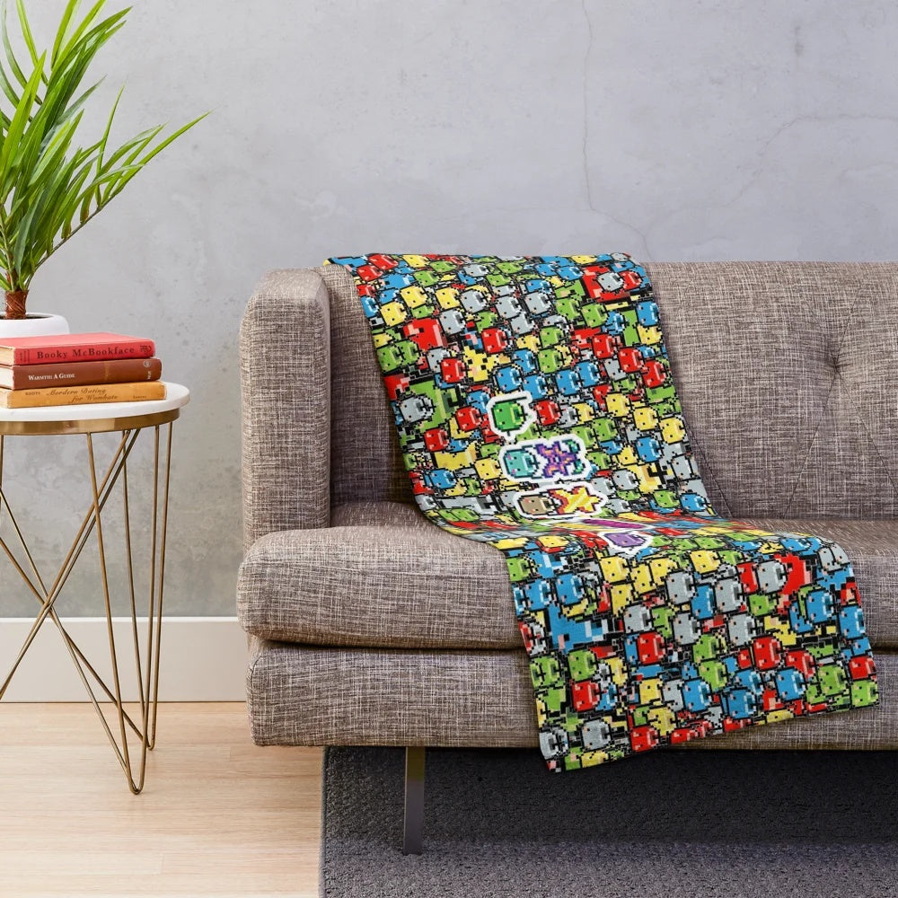 Stardew Valley inspired plush blanket with a colorful 8-bit junimo design
