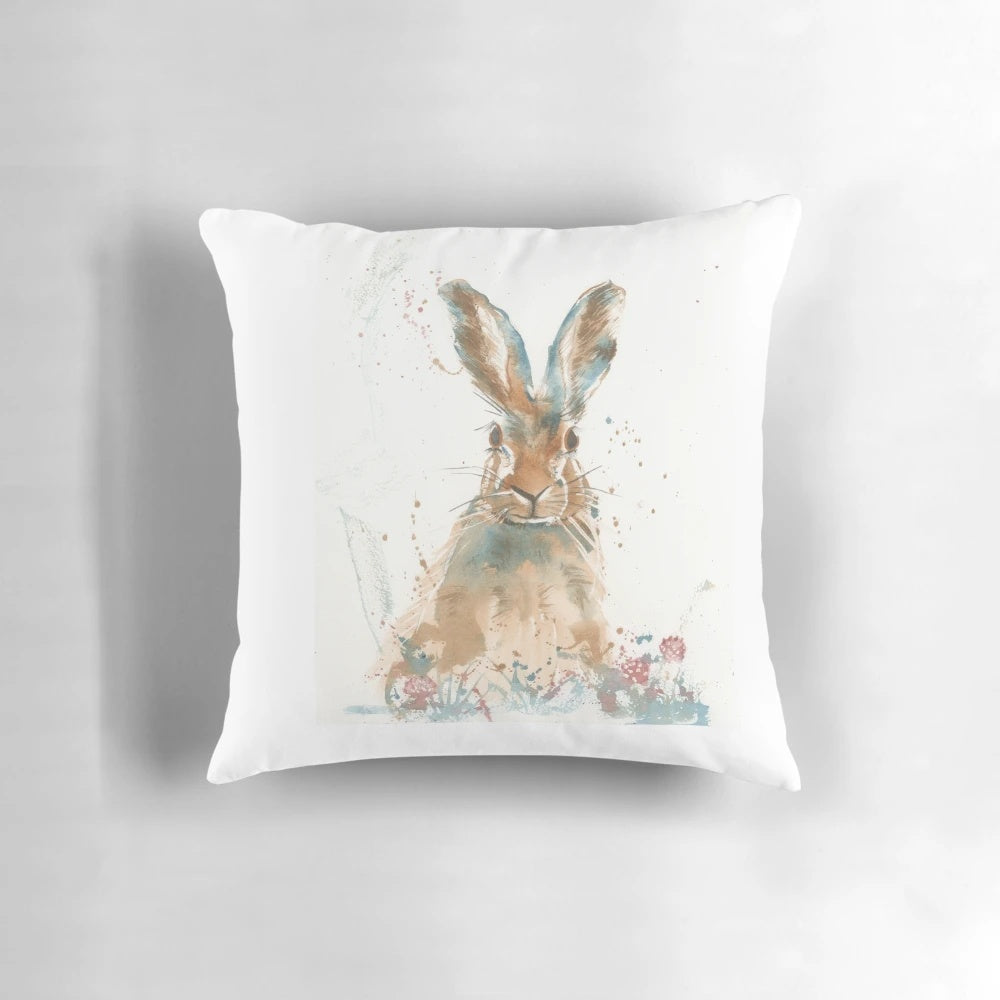 Vibrant watercolor painting of a startled hare on a decorative accent pillow.