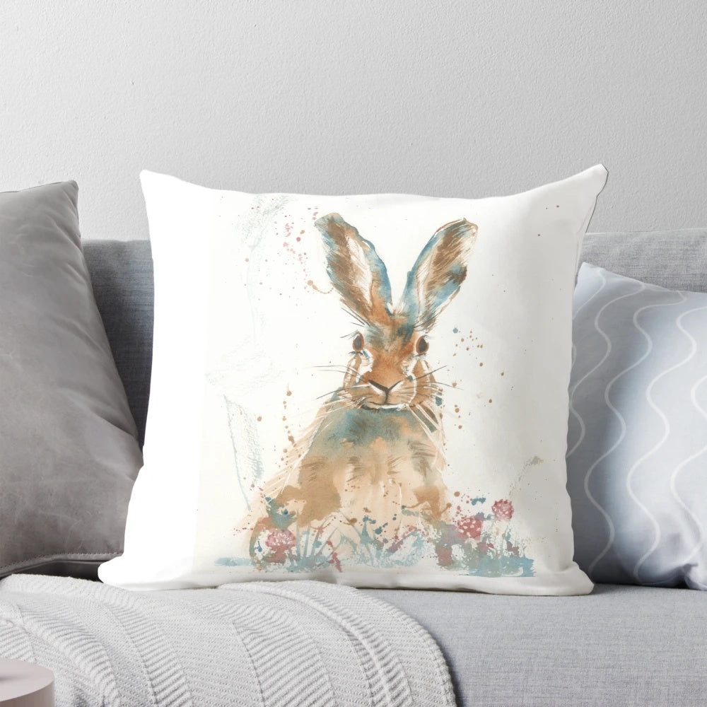 Vibrant watercolor painting of a startled hare on a decorative accent pillow.