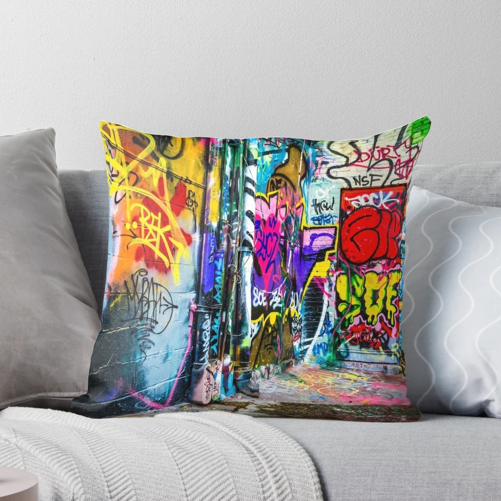 Colorful abstract graffiti-style street art design printed on a decorative throw pillow.