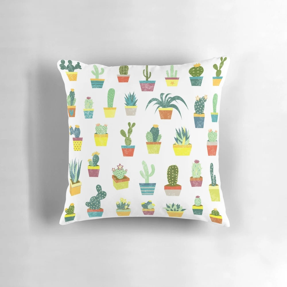 Colorful succulent pillow featuring a variety of desert plants and flowers