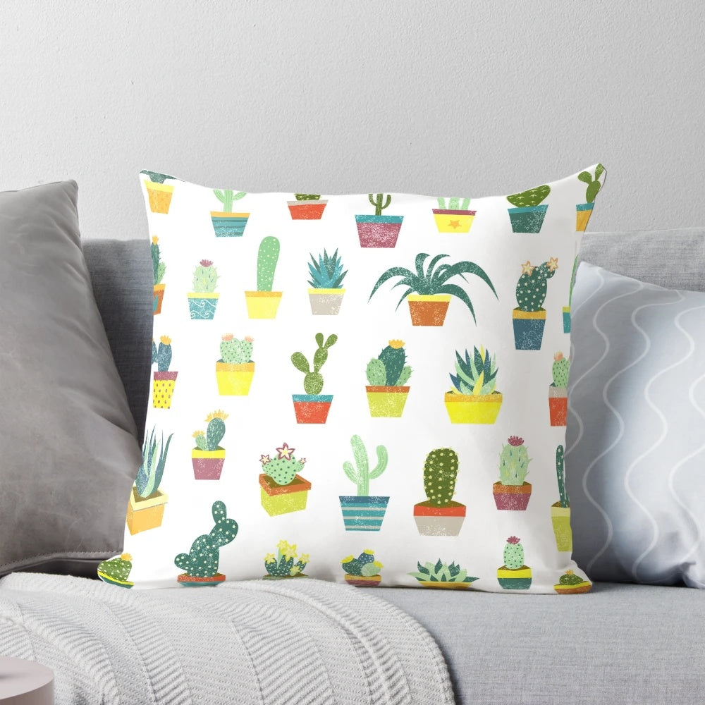 Colorful succulent pillow featuring a variety of desert plants and flowers
