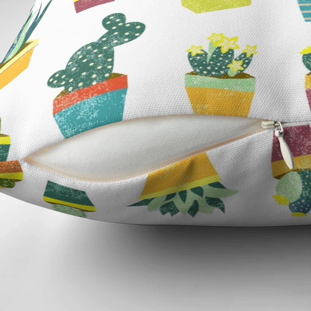 Colorful succulent pillow featuring a variety of desert plants and flowers