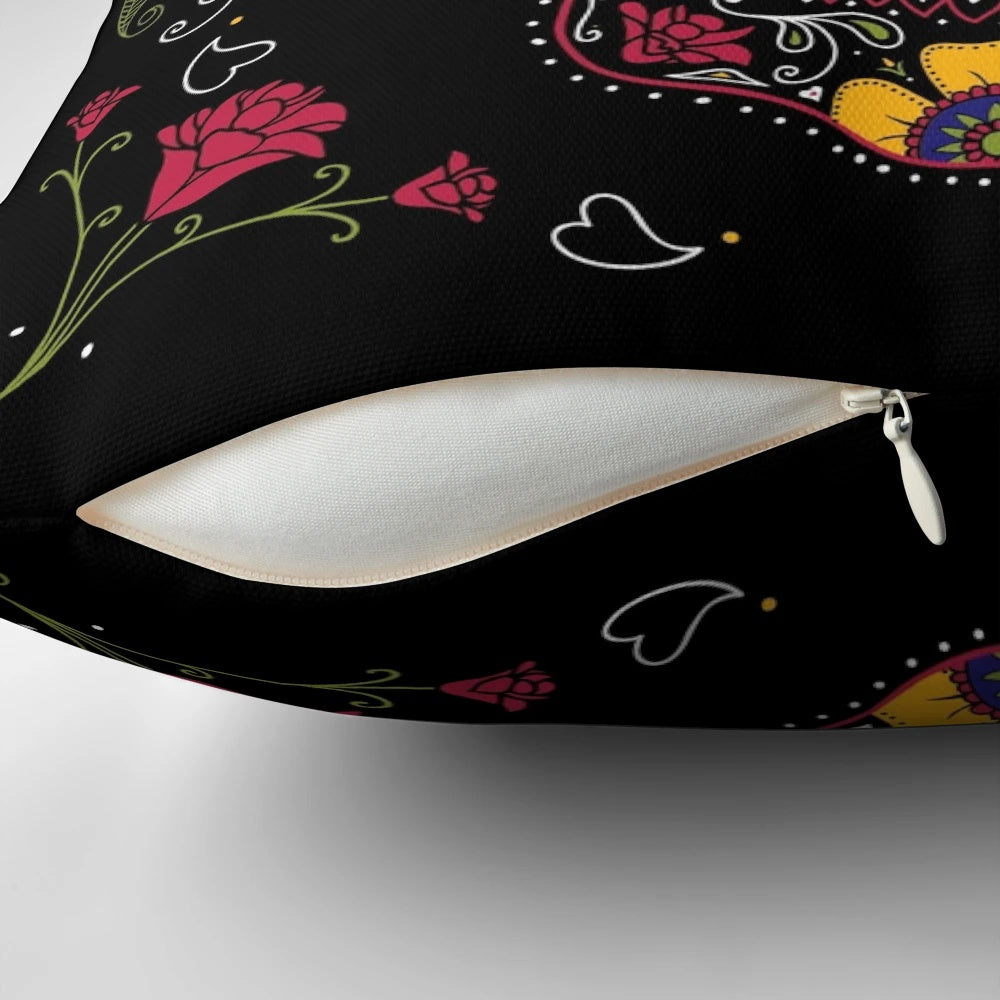 A dark, colorful sugar skull design pillow with floral and symmetrical patterns.