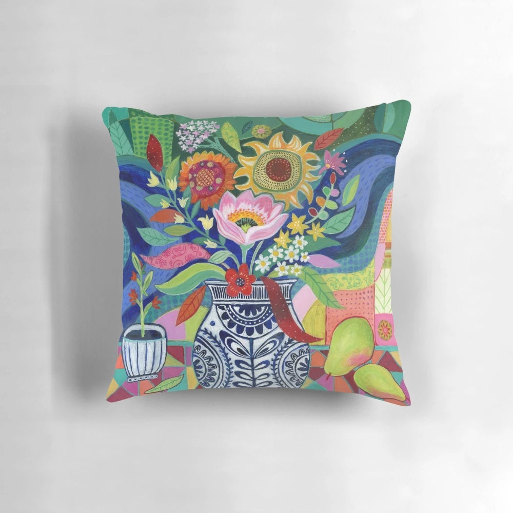Colorful floral still life decorative pillow featuring a vase of bright summer blooms