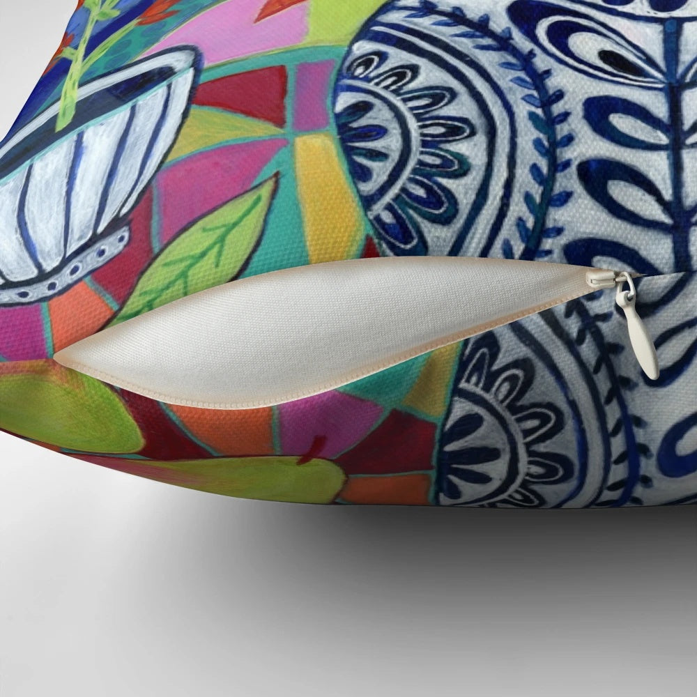 Colorful floral still life decorative pillow featuring a vase of bright summer blooms