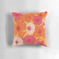 Colorful retro-style floral pattern decorative throw pillow in pink, yellow, and orange