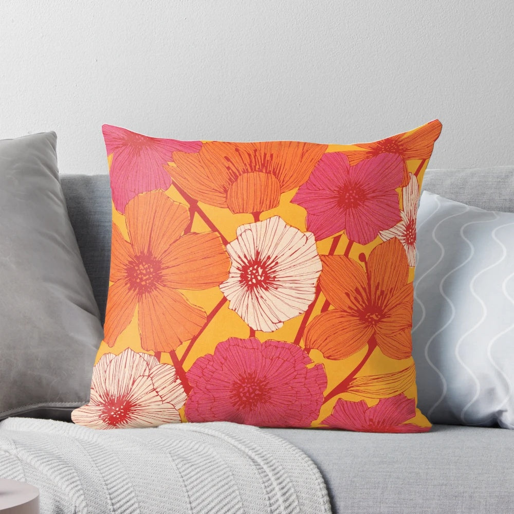 Colorful retro-style floral pattern decorative throw pillow in pink, yellow, and orange