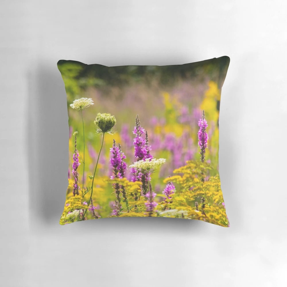 Colorful photograph of a blooming summer meadow printed on a soft, decorative pillow