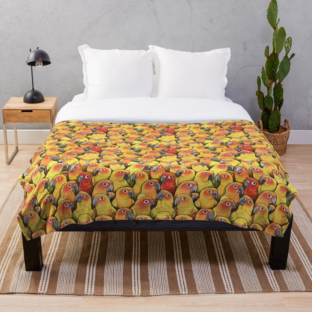 Plush blanket featuring a colorful sun conure parrot design