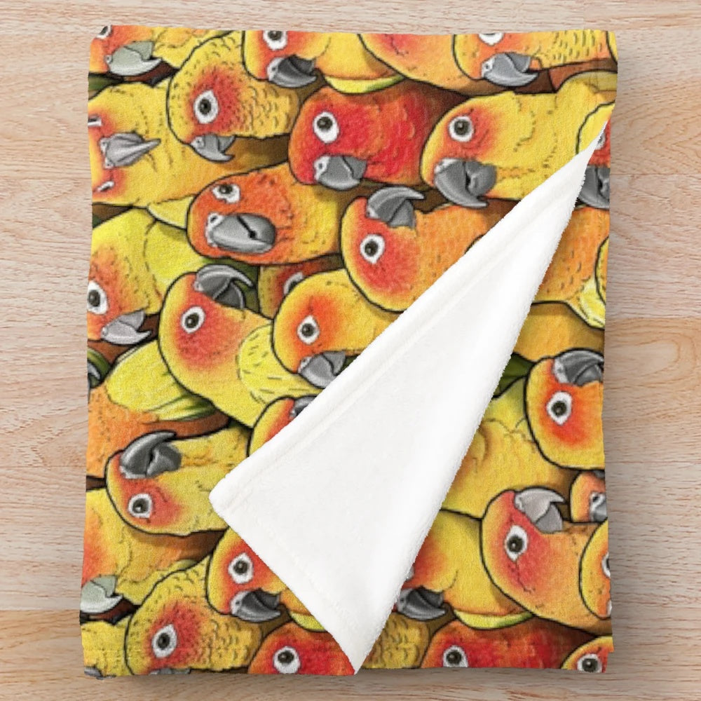Plush blanket featuring a colorful sun conure parrot design