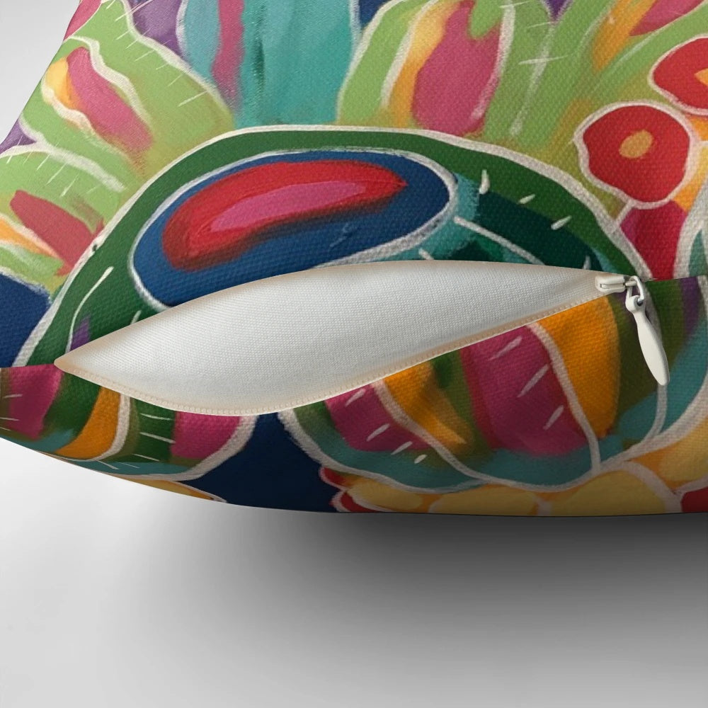 A vibrant sunset-inspired pillow featuring hummingbirds, cacti, and blooming flowers in a southwestern style.