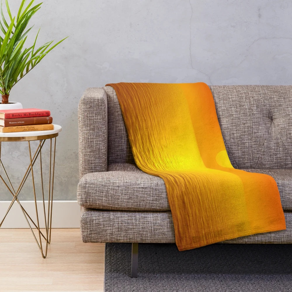 Sunset reflection pattern on a soft, plush blanket