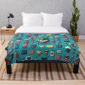 Colorful plush blanket featuring superhero-inspired graphic patterns and designs