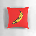 A vibrant and surreal big yellow banana decorative throw pillow featuring graphic design and vector art elements.