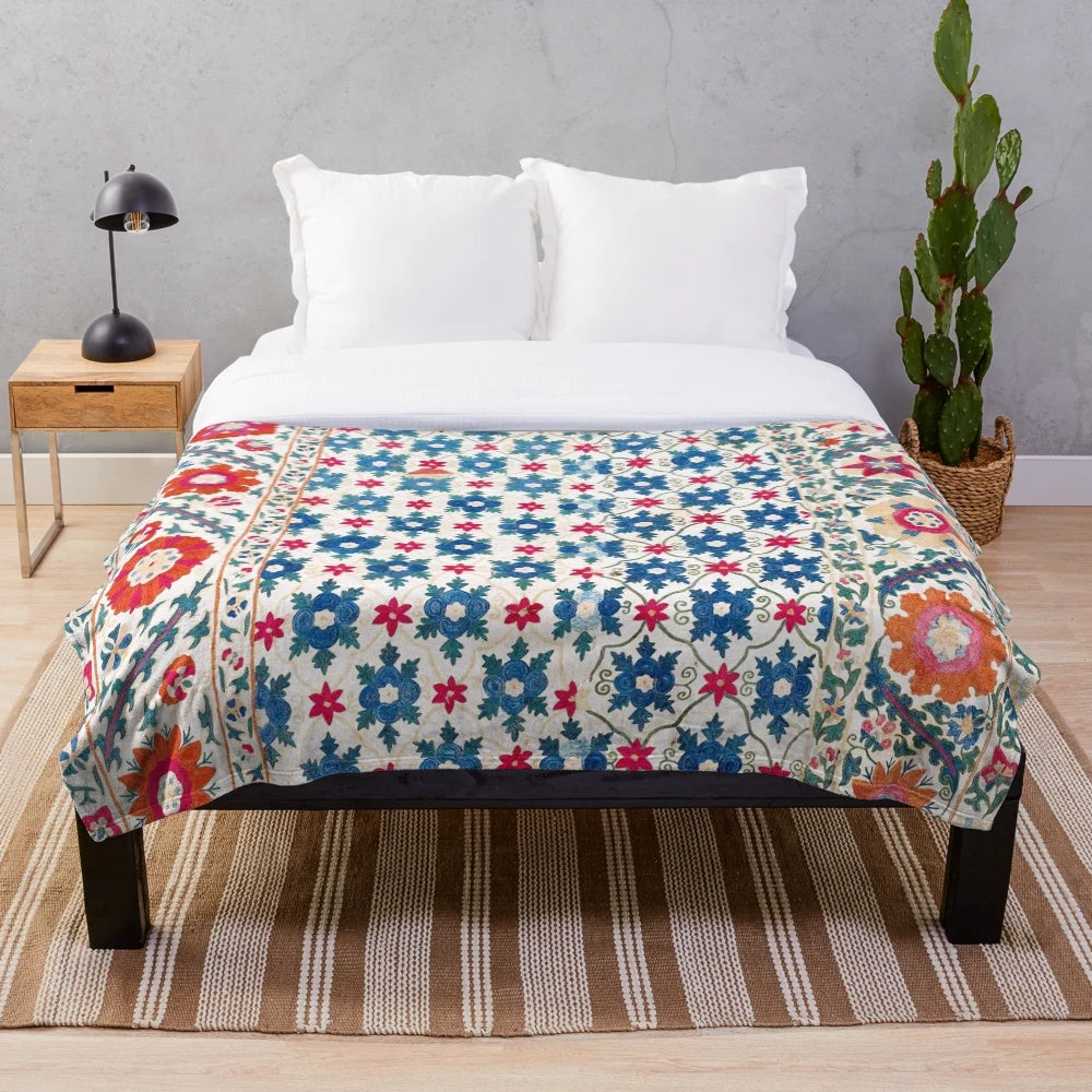 Colorful suzani embroidered plush blanket with ethnic geometric patterns