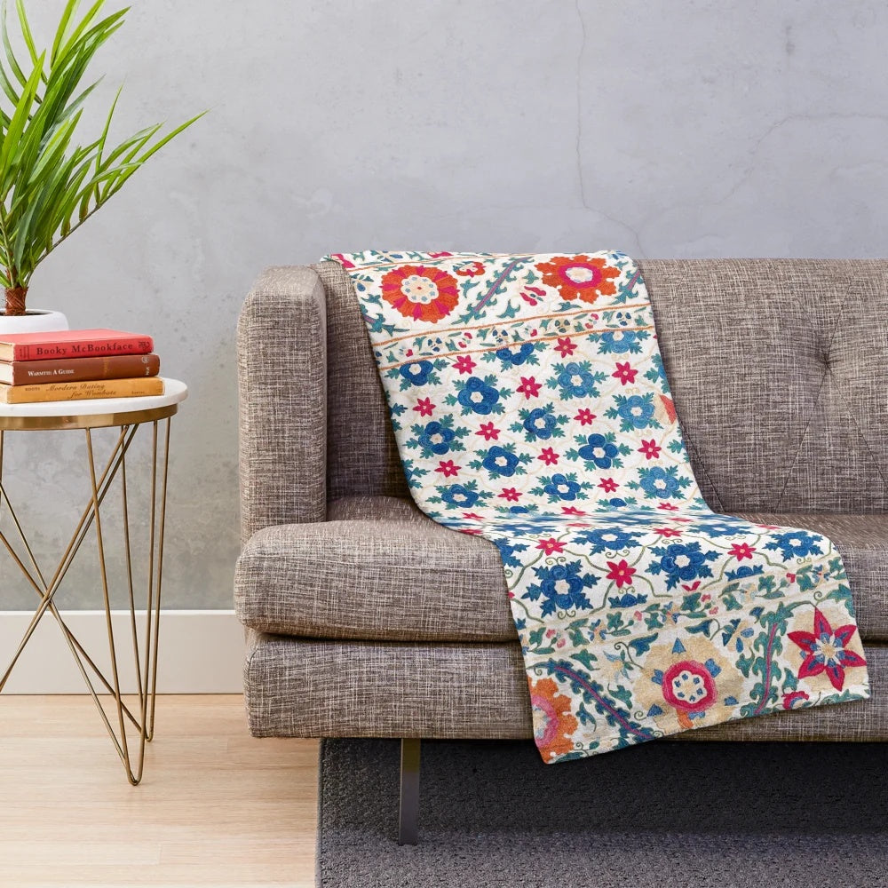 Colorful suzani embroidered plush blanket with ethnic geometric patterns
