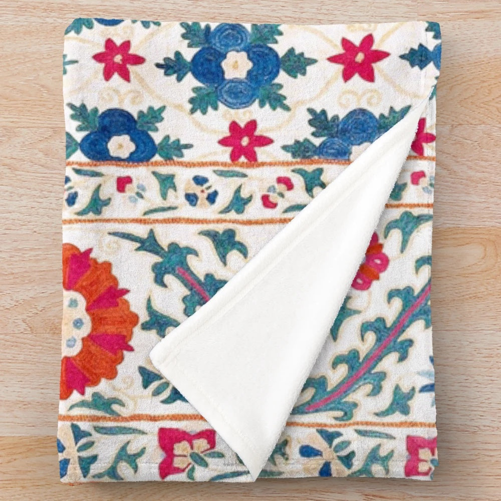 Colorful suzani embroidered plush blanket with ethnic geometric patterns