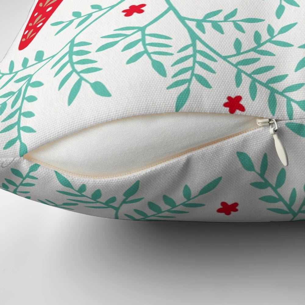 Decorative throw pillow featuring a pair of red and mint Swedish Dala horses against a symmetrical leaf pattern.
