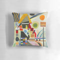 A colorful, abstract swinging pillow featuring geometric shapes and patterns in the style of Russian artist Wassily Kandinsky.