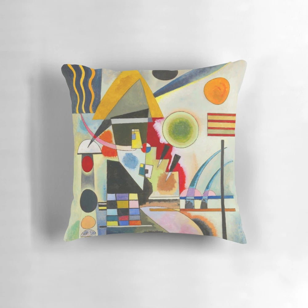 A colorful, abstract swinging pillow featuring geometric shapes and patterns in the style of Russian artist Wassily Kandinsky.
