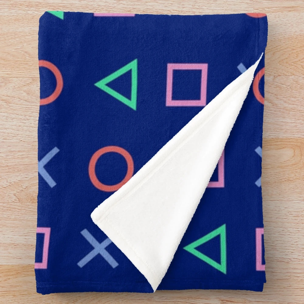 Blue and pink synthwave-inspired plush blanket with Playstation controller buttons design