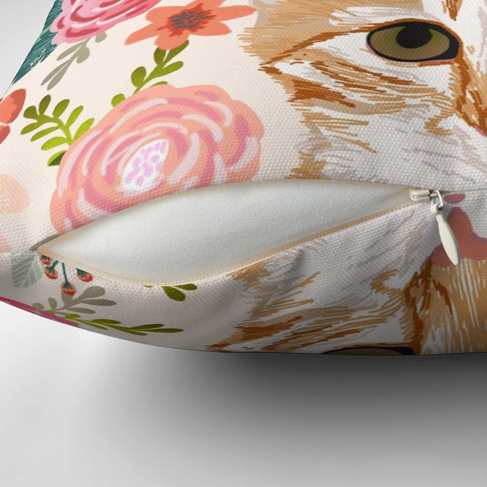 Decorative pillow featuring a vibrant floral pattern with a cute tabby cat central motif