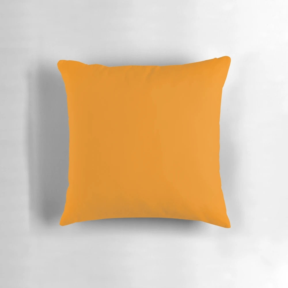 Vibrant tangerine-colored pillow with a solid, plain design, showcasing a range of orange hues.