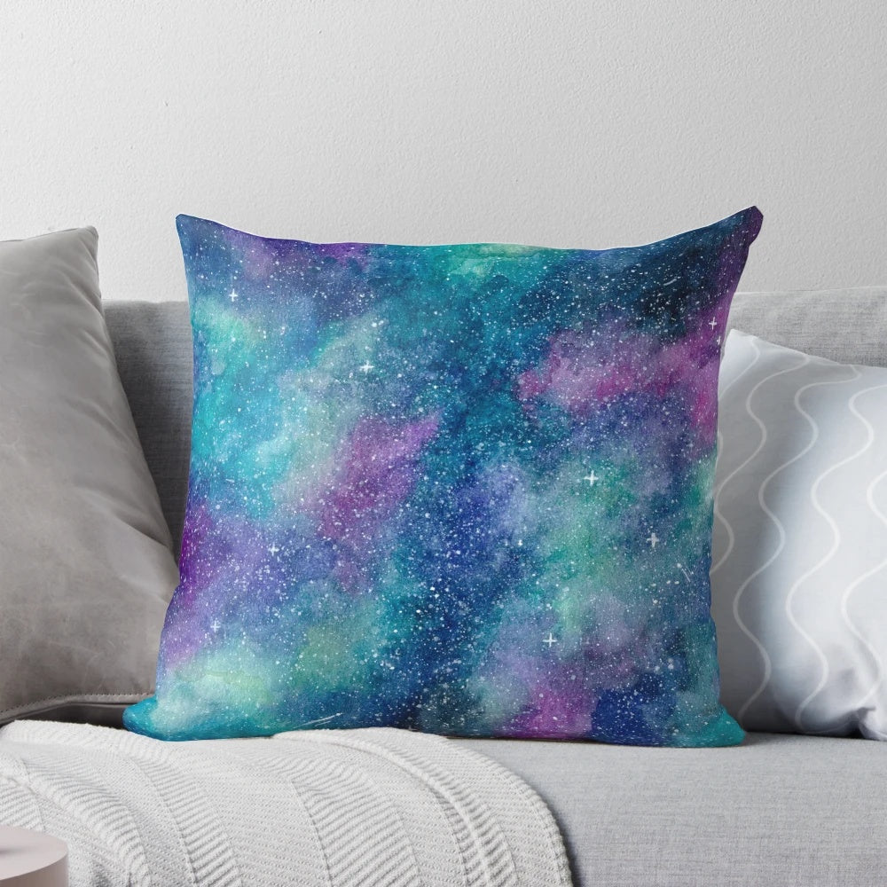 Teal, blue, and purple watercolor galaxy design on a square throw pillow