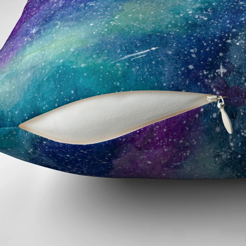 Teal, blue, and purple watercolor galaxy design on a square throw pillow