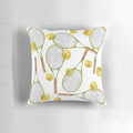 Colorful throw pillow with a pattern of tennis rackets and balls, ideal for sports-themed home decor