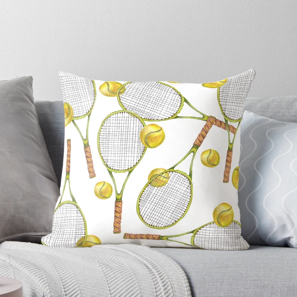 Colorful throw pillow with a pattern of tennis rackets and balls, ideal for sports-themed home decor