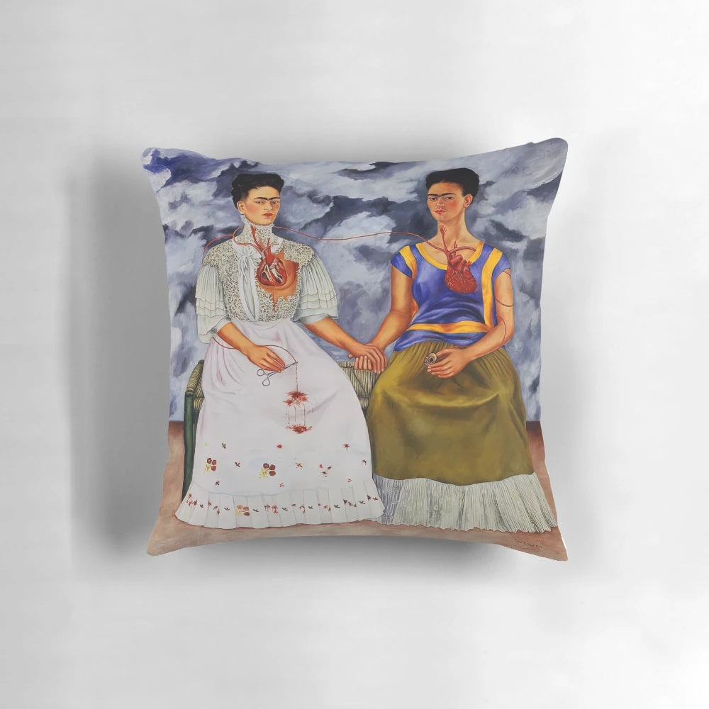 Colorful Frida Kahlo inspired pillow depicting "The Two Fridas" painting