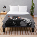 Colorful plush blanket featuring an urban chimpanzee in a thoughtful pose