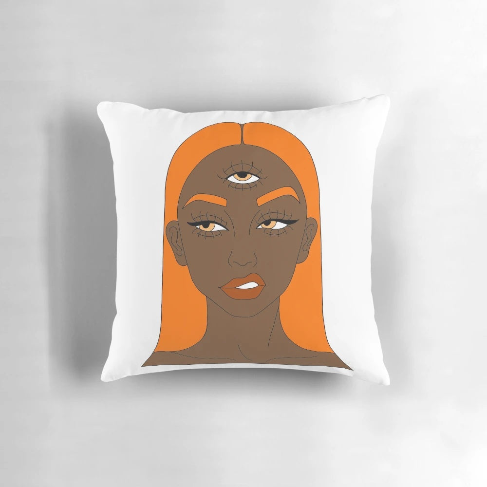 Vibrant orange and black digital art illustration of a girl with a third eye, featured on a plush pillow.