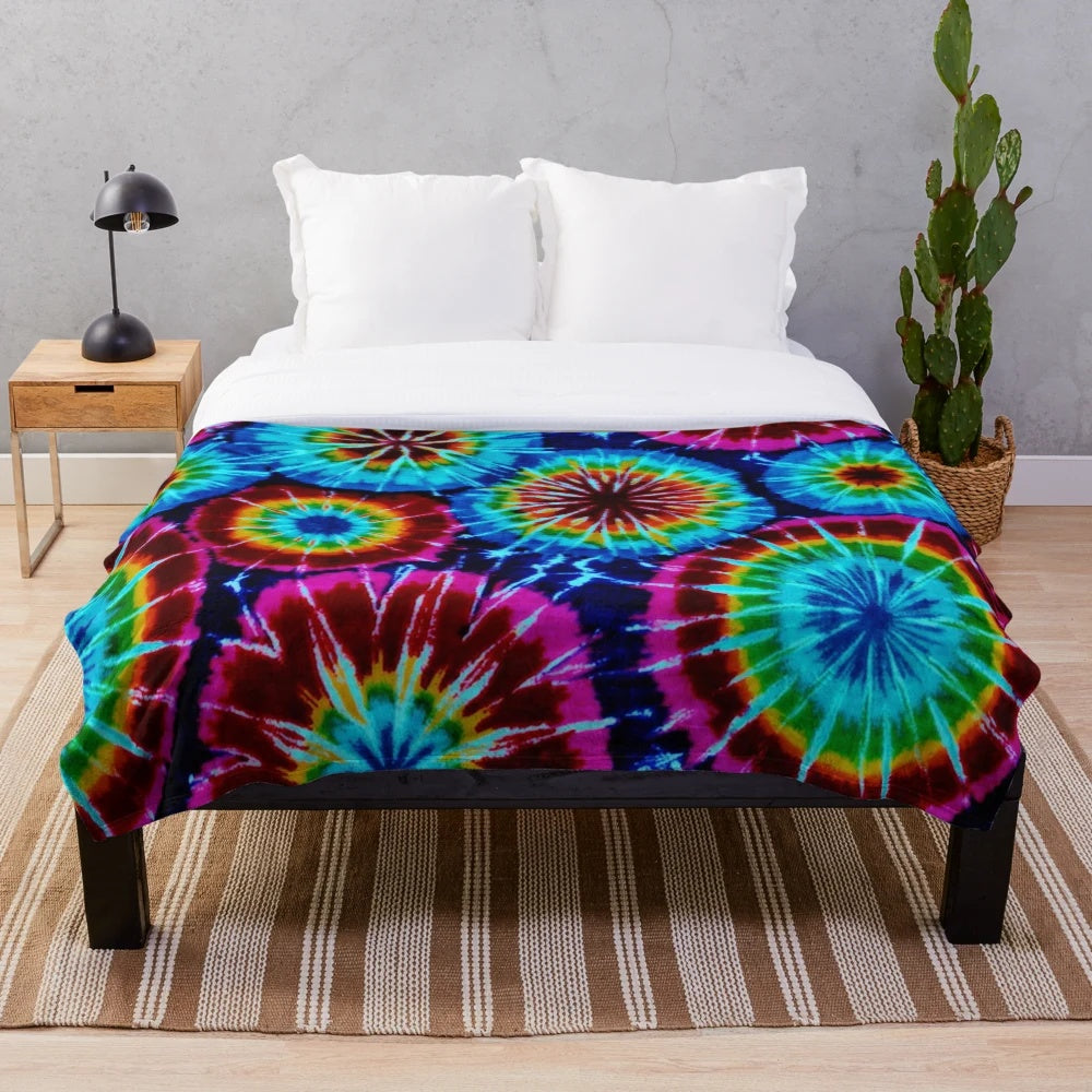 Colorful tie dye plush blanket with a soft, cozy texture