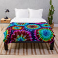 Colorful tie dye plush blanket with a soft, cozy texture