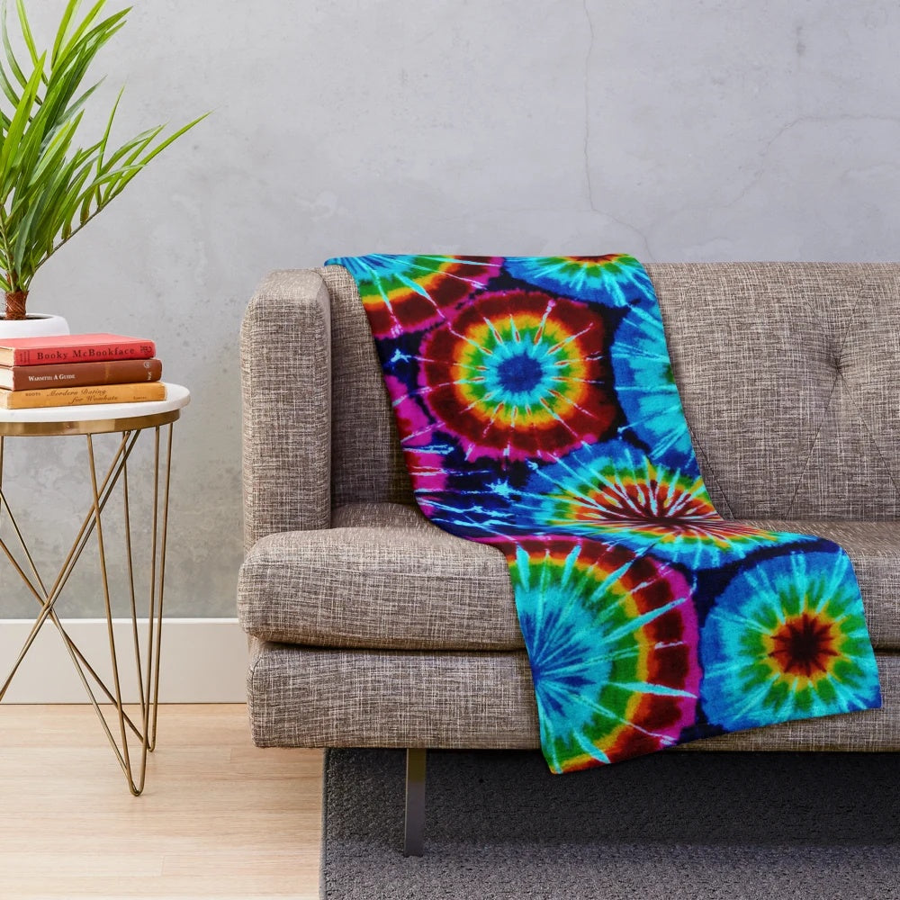 Colorful tie dye plush blanket with a soft, cozy texture