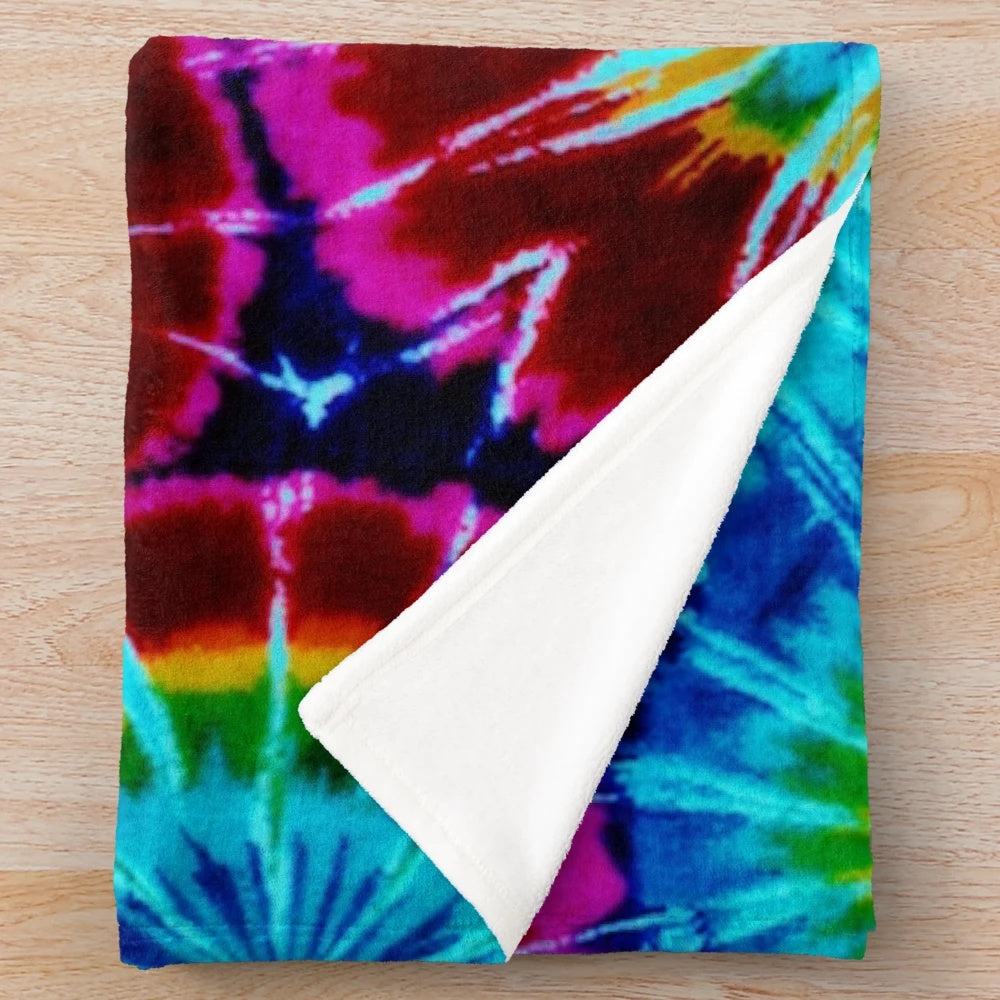 Colorful tie dye plush blanket with a soft, cozy texture