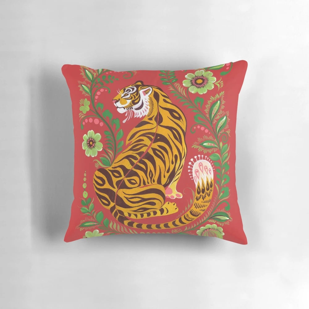 Colorful decorative pillow featuring a tiger in a folk art style