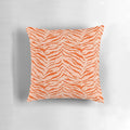 Closeup of an orange and black tiger print pillow