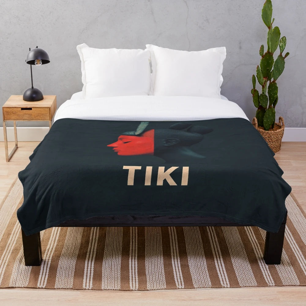 Colorful tiki art plush blanket with bold tribal pattern