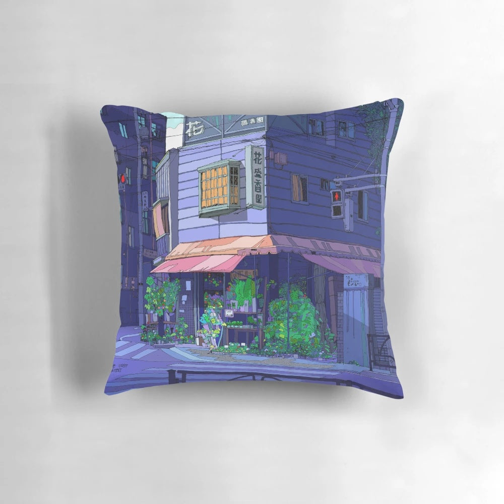 Colorful throw pillow featuring an illustration of a Tokyo flower shop in a bustling urban setting