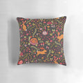Colorful decorative throw pillow featuring a whimsical design of a tortoise and hare in a botanical garden setting.