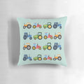 Colorful tractor-themed pillow with orange, red, green, and blue tractors