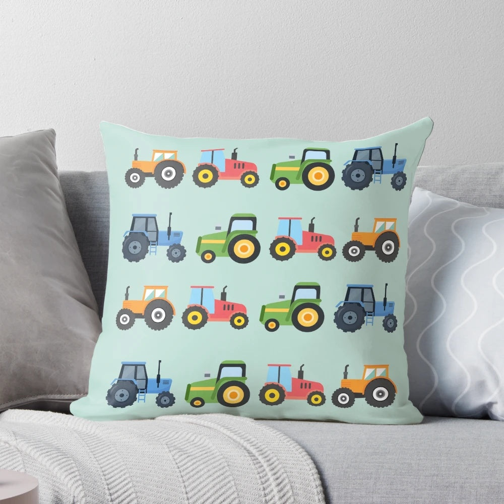 Colorful tractor-themed pillow with orange, red, green, and blue tractors