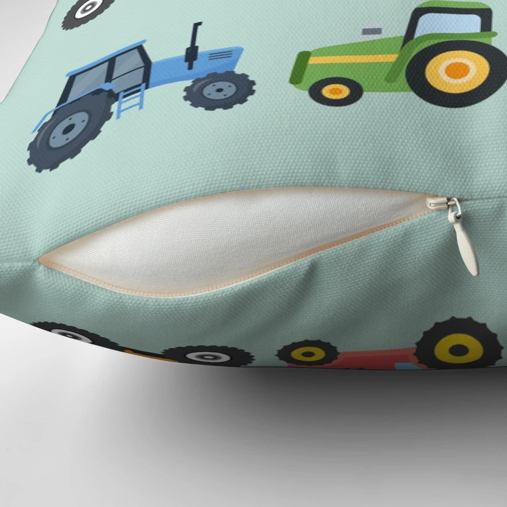 Colorful tractor-themed pillow with orange, red, green, and blue tractors